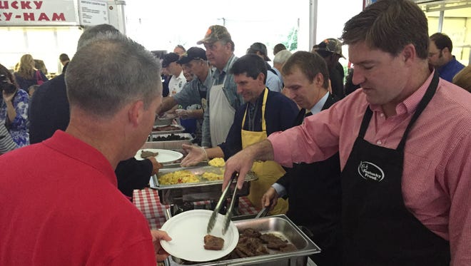 Jack Conway serves up the morning meal at the annual Commodity Breakfast at the Kentucky State Fair.