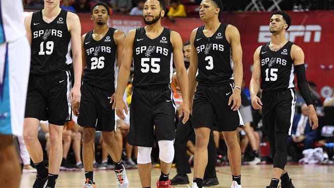 After spending time with the Austin Spurs, point guard Galen Robinson Jr., center, is facing an uncertain future. But a side venture, raising funds toward various Black-related organizations, is taking off.
