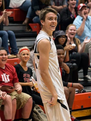 U of L recruit Ryan McMahon and his fans react to his last shot falling and his setting a new record of 26 points during the 3-point shootout at the 2015 Kentucky Derby Festival Basketball Classic at New Albany High School. 4/10/15