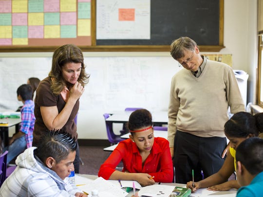 Bill and Melinda Gates during a 2012 visit to a classroom in at South Denver High, where they worked with students on assignments.