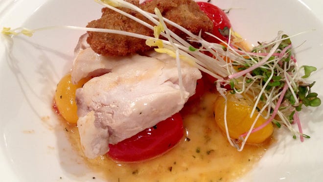 Chef-owner Harold Balink, of CRU in Fort Myers, cooked spear-caught Gulf grouper with crispy oysters, flash-sauteed Everglades tomatoes and buttery Florida orange sauce Friday night at the James Beard House in Manhattan.