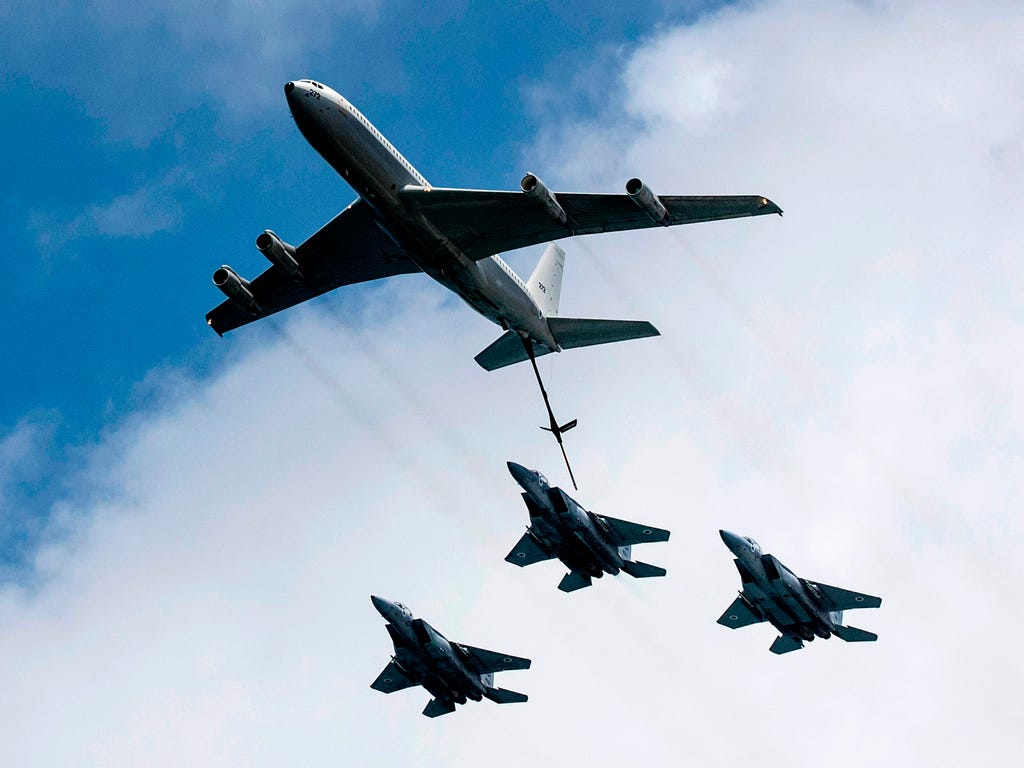 An Israeli KC-135 Stratotanker Boeing 707 and F-15 fighter jets perform during an air show over the beach in the Israeli coastal city of Tel Aviv as Israel marks Independence Day, 69 years since the establishment of the Jewish state.