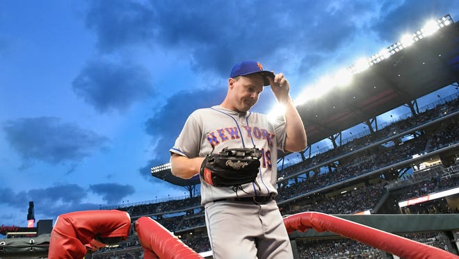 New York Mets right fielder Jay Bruce enters the dugout after the fourth inning of a baseball game against the Atlanta Braves on Saturday, April 21, 2018, in Atlanta.
