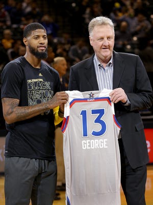 Indiana Pacers president Larry Bird presented Paul George (13) his 2017 NBA All-Star jersey before the start of their game against the Washington WizardsThursday, February 16, 2017, evening at at Bankers Life Fieldhouse.