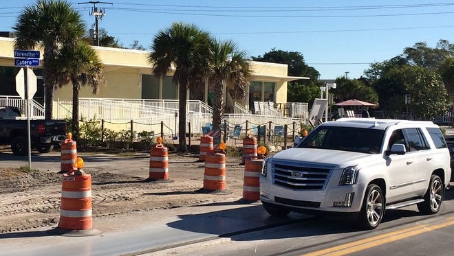 Steel plates cover the paving stones in median strips as traffic on Estero Boulevard in Fort Myers Beach is diverted to the center of the road to allow for road construction to continue.