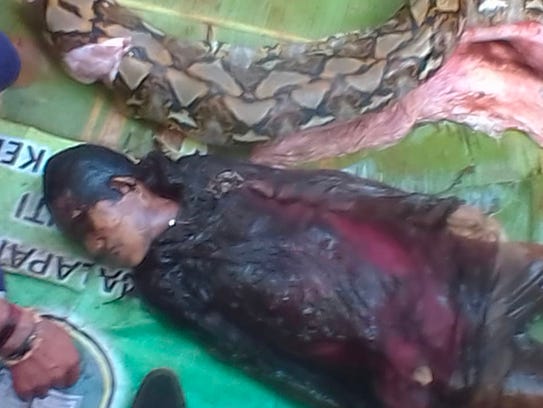 The body of 54-year-old Wa Tiba (bottom) lies next