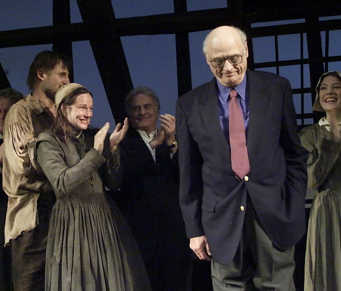 Actors applaud playwright Arthur Miller at the Virginia Theater in New York City on March 7, 2002.