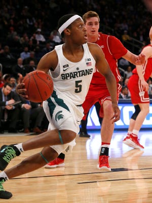 Michigan State Spartans guard Cassius Winston (5) drives to the baseline against Wisconsin Badgers during first half 2018 Big Ten Tournament quarterfinals at Madison Square Garden.
