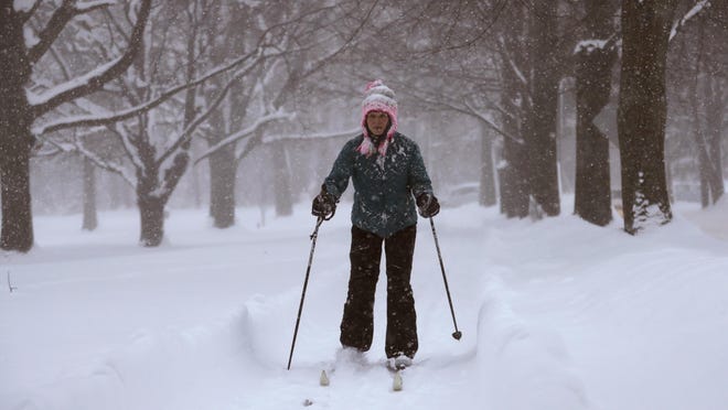 Jael Lippert cross country skis, Friday, Dec. 29, 2017, in Erie, Pa. The cold weather pattern was expected to continue through the holiday weekend and likely longer, according to the National Weather Service, prolonging a stretch of brutal weather blamed for several deaths, crashes and fires. (AP Photo/Tony Dejak)