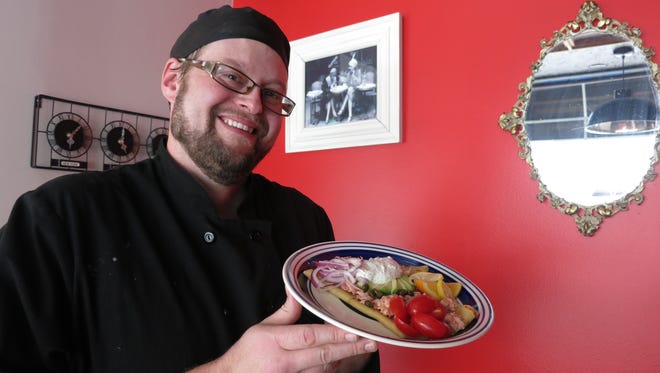 Chef Robert Gunter displays a dish at The Crepe — previously called What Crepe? — in Royal Oak.