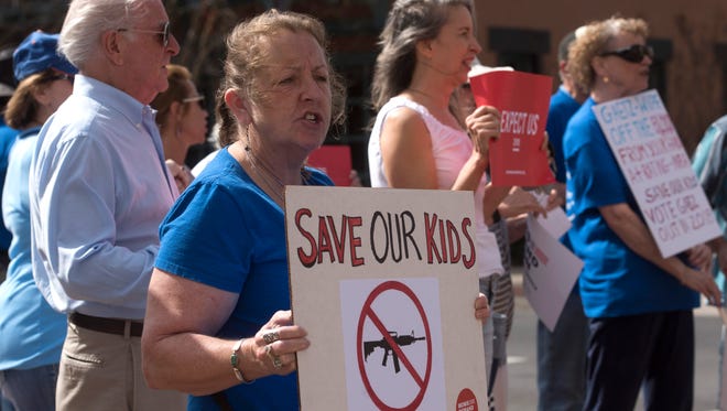 Gun Control advocates gather on the sidewalk outside Congressman Matt Gaets office in downtown Pensacola , Tuesday, Feb. 20, 2018, callling on the legislator to act on gun control. The prostest come in the wake of last weeks school shooting in ParKland, Florida. 