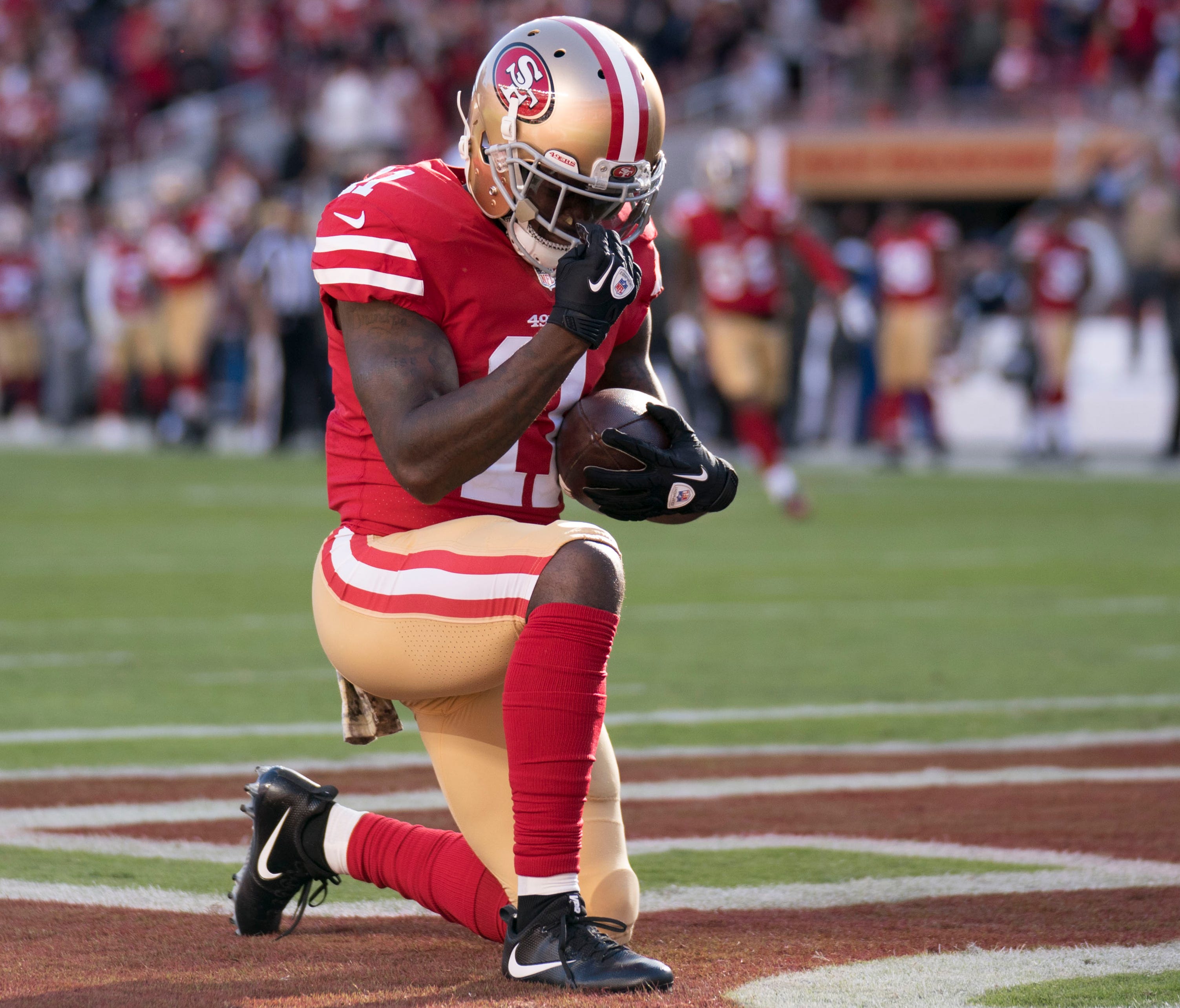 San Francisco 49ers wide receiver Marquise Goodwin (11) celebrates after scoring a touchdown against the New York Giants during the second quarter at Levi's Stadium.