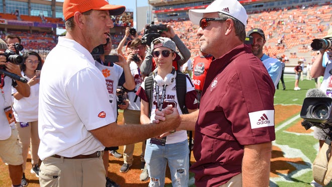 Clemson coach Dabo Swinney, (left) chats with Texas A&M coach Jimbo Fisher before their game on Sept. 7, 2019, in Clemson, S.C