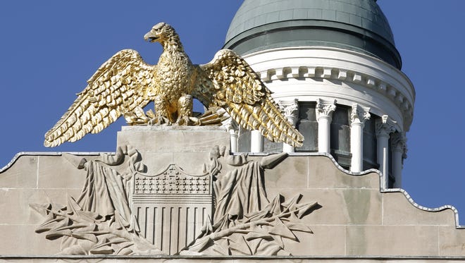 A golden eagle watches over the south side of the Indiana Statehouse in Indianapolis, shown on Wednesday, November 11, 2009.