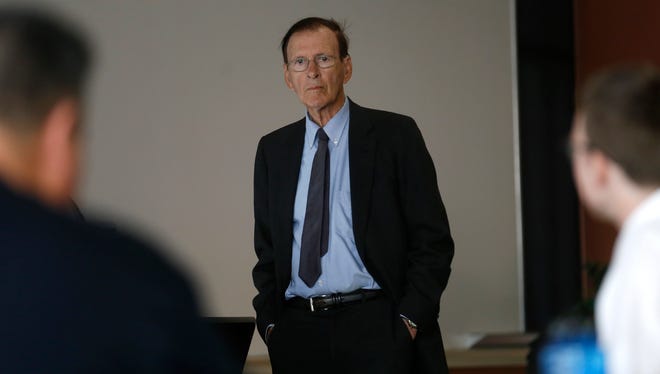 Daniel Fine, associate director of New Mexico Center for Energy Policy at New Mexico Tech speaks on Tuesday at San Juan College's Quality Center for Business in Farmington about "boom and bust" cycles in the oil and gas industry.