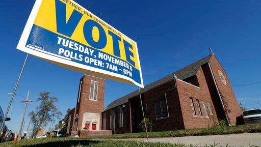 A get out the vote sign is shown outside St. Matthew Missionary Baptist Church in Detroit, Sunday, Nov. 6, 2016. At Sunday services, in rallies and on social media, black pastors labored to persuade congregants they should vote, hoping to minimize an expected drop in black voter participation this Election Day compared to four years ago when Barack Obama was a candidate. (AP Photo/Paul Sancya)