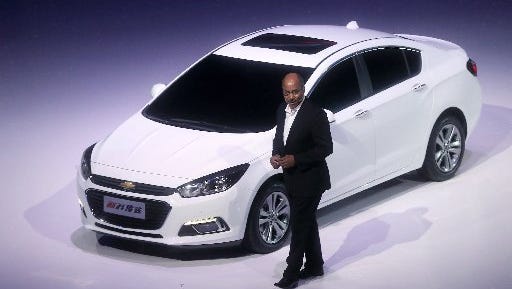 Ed Welburn, GM vice president of Global Design, introduces the next-generation Chevrolet Cruze during a world premiere ahead of Auto China 2014 in Beijing, China, April 19, 2014. (AP Photo/Ng Han Guan)