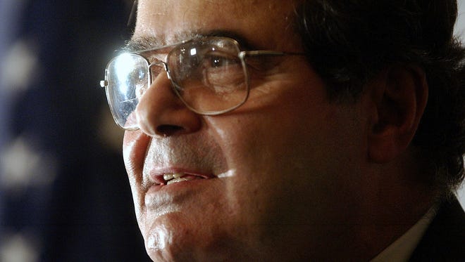 FILE - In this Saturday, Oct. 8, 2005 file photo, U.S. Supreme Court Justice Antonin Scalia speaks during a news conference in New York. On Saturday, Feb. 13, 2016, the U.S. Marshals Service confirmed that Scalia has died at the age of 79. (AP Photo/Chad Rachman)