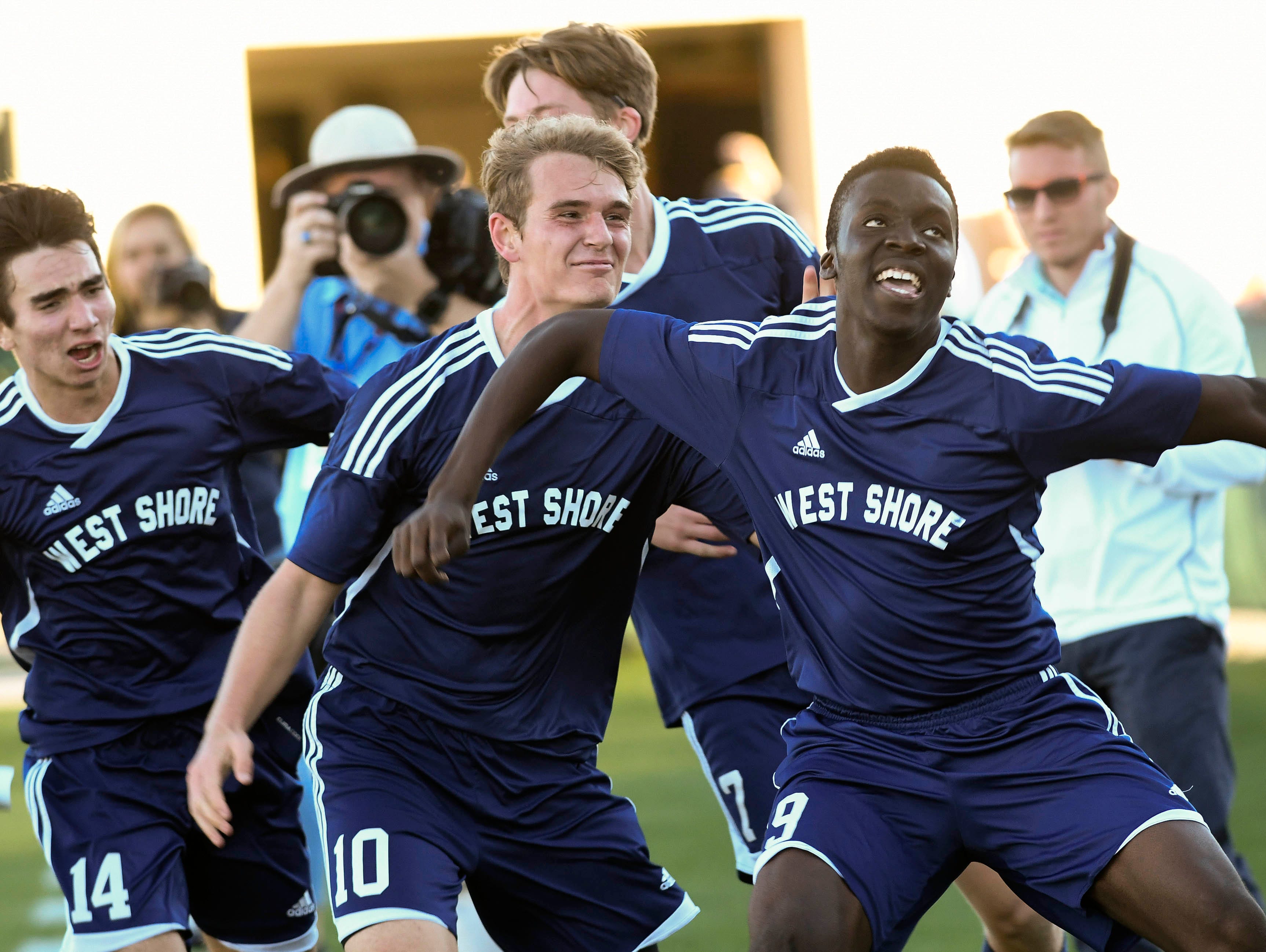 West Shore players celebrate the game winning goal by Amugo Chukwunenye (19) during Thursday's Class 2A championship in Deland.