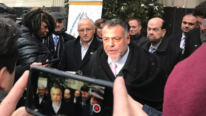 Detroit attorney Nabih Ayad, founder of the Arab American Civil Rights League, is concerned about CVE (Countering Violent Extremism) programs that critics say unfairly target Muslims and Arab-Americans in places like Michigan. In the photo, behind him on the right is Dearborn Mayor Jack O'Reilly, who has worked on CVE programs in Dearborn as part of efforts to keep the city safe.  In photo, they're in front of U.S. District Court in Detroit after filing a lawsuit on Jan 31, 2017 challenging Pres. Trump's travel ban on several Muslim-majority countries.