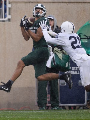 Michigan State's Cody White makes a catch over Penn State's Amani Oruwariye in the second quarter. After a review the pass was ruled incomplete.