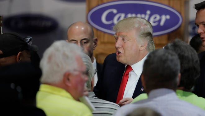 Donald Trump talks with workers at Carrier Corp., Indianapolis, Dec. 1, 2016.