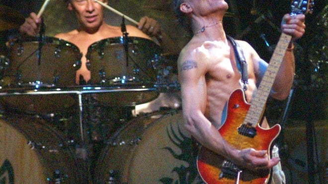 Alex Van Halen, left, and Eddie Van Halen perform at the Worcester Centrum Centre in 2004.