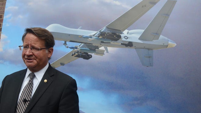 Michigan Senator Gary Peters, standing before a poster of a MQ-9, said the future is bright for the Battle Creek Air National Guard base.