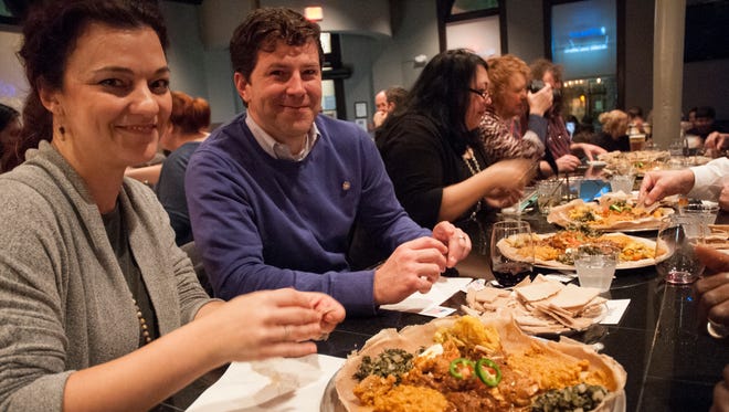 This Advertiser file photo shows Melissa and Stephen Gaubert of Lafayette dining at an Ethiopian dinner at the Jefferson Street Pub. World Kitchen Pop-Up is putting on a benefit event that will allow diners to taste the world for a good cause.