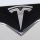 (FILES) This file photo taken on Dec. 20, 2016 shows the Tesla logo in Washington, D.C. In another setback for the high-flying electric carmaker, Tesla's Model S once again fell short of the top rating in a key crash test, an independent testing agency said July 6, 2017. On the eve of seeing its first mass-market Model 3 roll off the assembly line, the Insurance Institute for Highway Safety said that despite changes made to the vehicles produced after January, the Model S was again only able to attain an acceptable rating in the small-overlap test conducted in February. That test mimics a car hitting a tree or a pole.