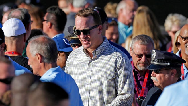 Aug 6, 2016; Canton, OH, USA; Denver Broncos former quarterback Peyton Manning takes his seat at the festivities during NFL Pro Football Hall of Fame Enshrinement Ceremony at Tom Benson Stadium.