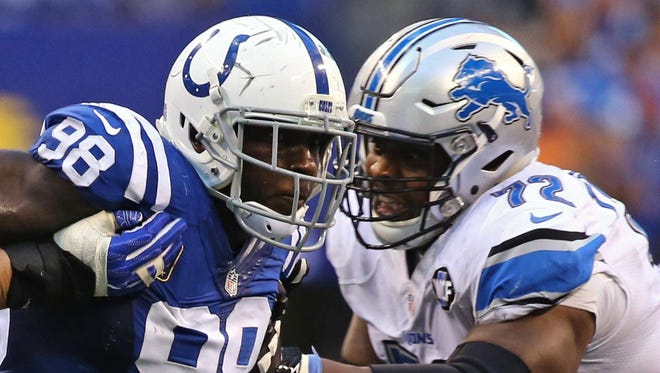 Colts linebacker Robert Mathis makes a move past Lions offensive lineman Laken Tomlinson during the Lions’ 39-35 win in Week 1.