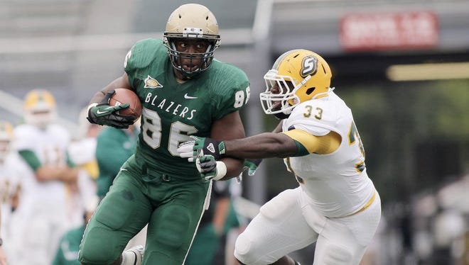 UAB tight end Kennard Backman, left, was the last of the Green Bay Packers' three sixth-round draft picks on Saturday.