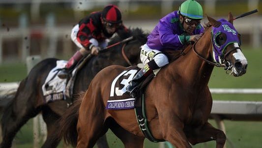 Victor Espinoza aboard California Chrome sprints to the finish in race twelve during the 2014 Breeders Cup Championships at Santa Anita Park. California Chrome would finish second.