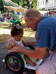 Marty Parzynski helps his niece Bella into her brand-new