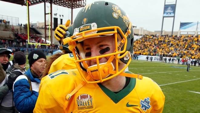 North Dakota State Bison quarterback Carson Wentz (11) reacts after the game against the Jacksonville State Gamecocks in the FCS Championship college football game at Toyota Stadium.