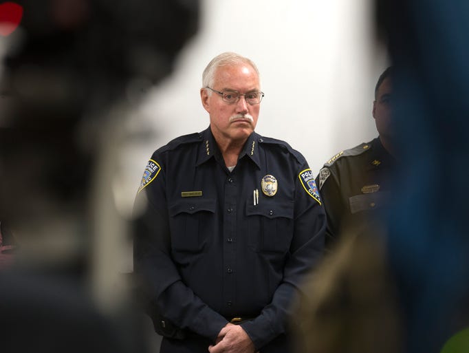 Aztec Police Chief Mike Heal participates in a press