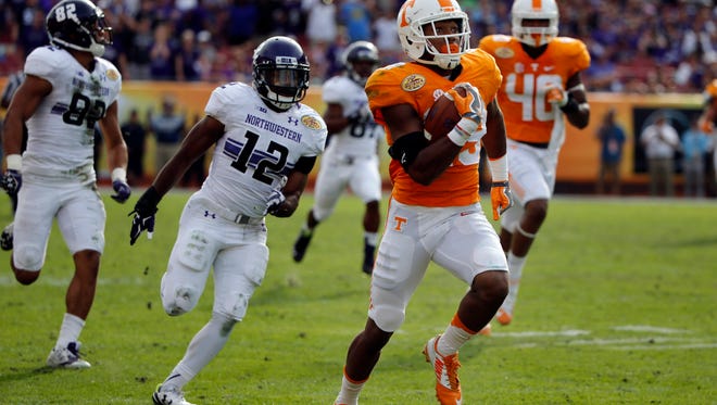 Tennessee defensive back Evan Berry (29) runs the ball back for a 100-yard interception return for a touchdown against Northwestern in the final seconds of the Outback Bowl on Jan. 1, 2016.