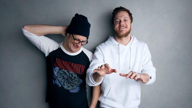 Director Don Argott, left, and Dan Reynolds pose for a portrait to promote the film, "Believer", at the Music Lodge during the Sundance Film Festival on Sunday, Jan. 21, 2018, in Park City, Utah. The Mormon frontman of the Imagine Dragons rock band hopes the Sundance Film Festival documentary that follows his journey to becoming an advocate for LGBT Mormon youth triggers real change by his religion’s leaders and puts an end to what he calls shaming of gay and lesbian kids in the religion. (Photo by Taylor Jewell/Invision/AP)