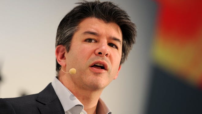 A picture taken on January 18, 2015 shows Travis Kalanick, co-founder of the US transportation network company Uber, speaking during the opening of the Digital Life Design (DLD) Conference in Munich.