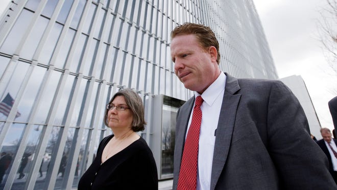 Utah businessman Jeremy Johnson leaves the Federal Courthouse in Salt Lake City in this March 25 file photo,. Johnson, who was a helicopter-flying philanthropist before he became a key figure in an influence-peddling scandal that ensnared two former state attorneys general, was convicted of making false statements to banks but cleared of dozens of other charges