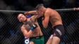 McGregor throws a punch at Nate Diaz in their rematch