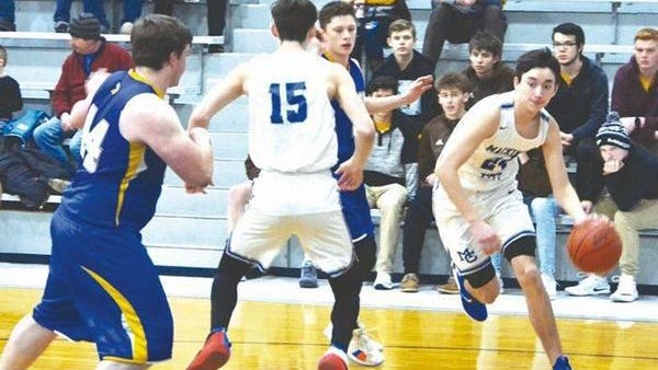 Mackinaw City's Kal O'Brien (right) drives to the basket during a district boys basketball contest against Alanson from the 2018-19 season. O'Brien, who earned All-Northern Lakes Conference and All-State honors as a junior, is expected to lead the Comets as a senior this season.