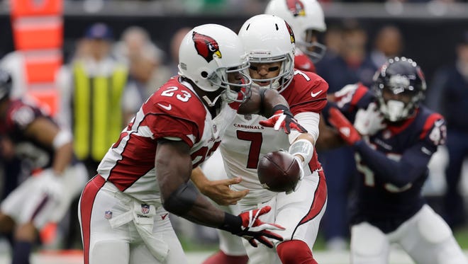 Arizona Cardinals running back Adrian Peterson (23) takes a handoff from Arizona Cardinals quarterback Blaine Gabbert (7) during the first half of an NFL football game against the Houston Texans, Sunday, Nov. 19, 2017, in Houston.