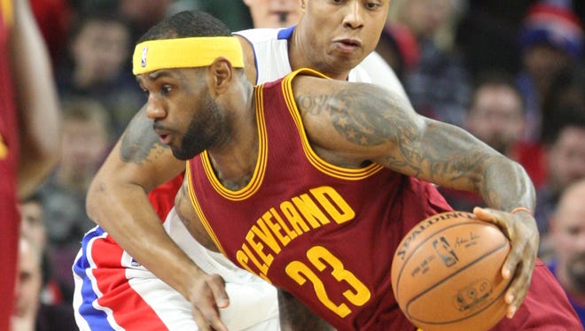 Pistons forward Caron Butler defends Cavaliers forward LeBron James during the second period  of the Cavs' 103-95 win Tuesday at the Palace.