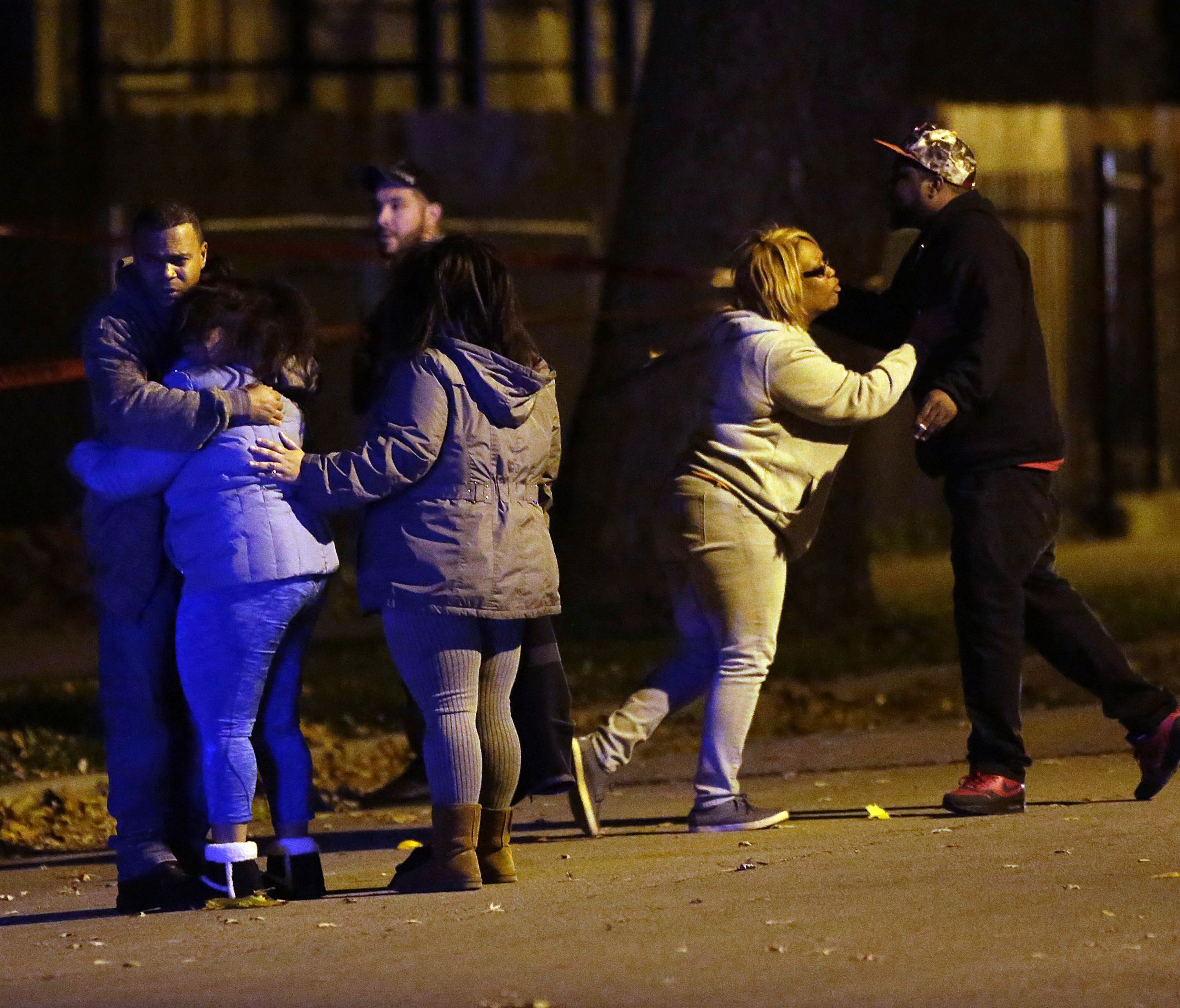 Family members react after U.S. Rep. Danny Davis' 15-year-old grandson was shot in the head and killed during a home invasion in the 5600 block of South Princeton Avenue on Nov. 18, 2016, in Chicago.