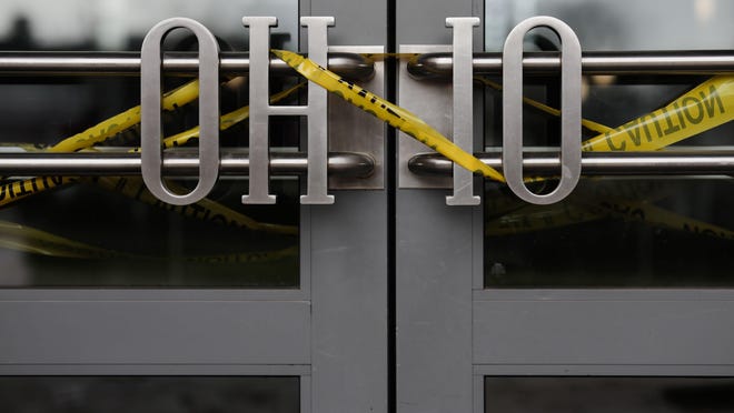Caution tape was wrapped around the entrance to the Ohio Union on Tuesday, April 14, 2020, at Ohio State University after the campus closed in the spring and classes went online due to the COVID-19 pandemic.