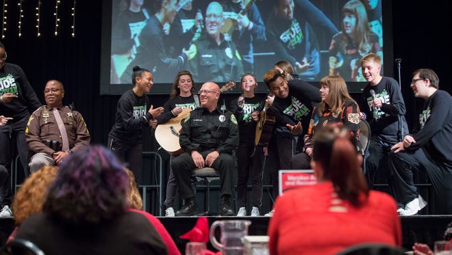 Members of the Pride team sing to members of local law enforcement during the Red Ribbon Breakfast on Oct. 24 at the Horizon Convention Center. The annual event helps kick off Red Ribbon Week and highlight the efforts by the Delaware County Prevention Council.