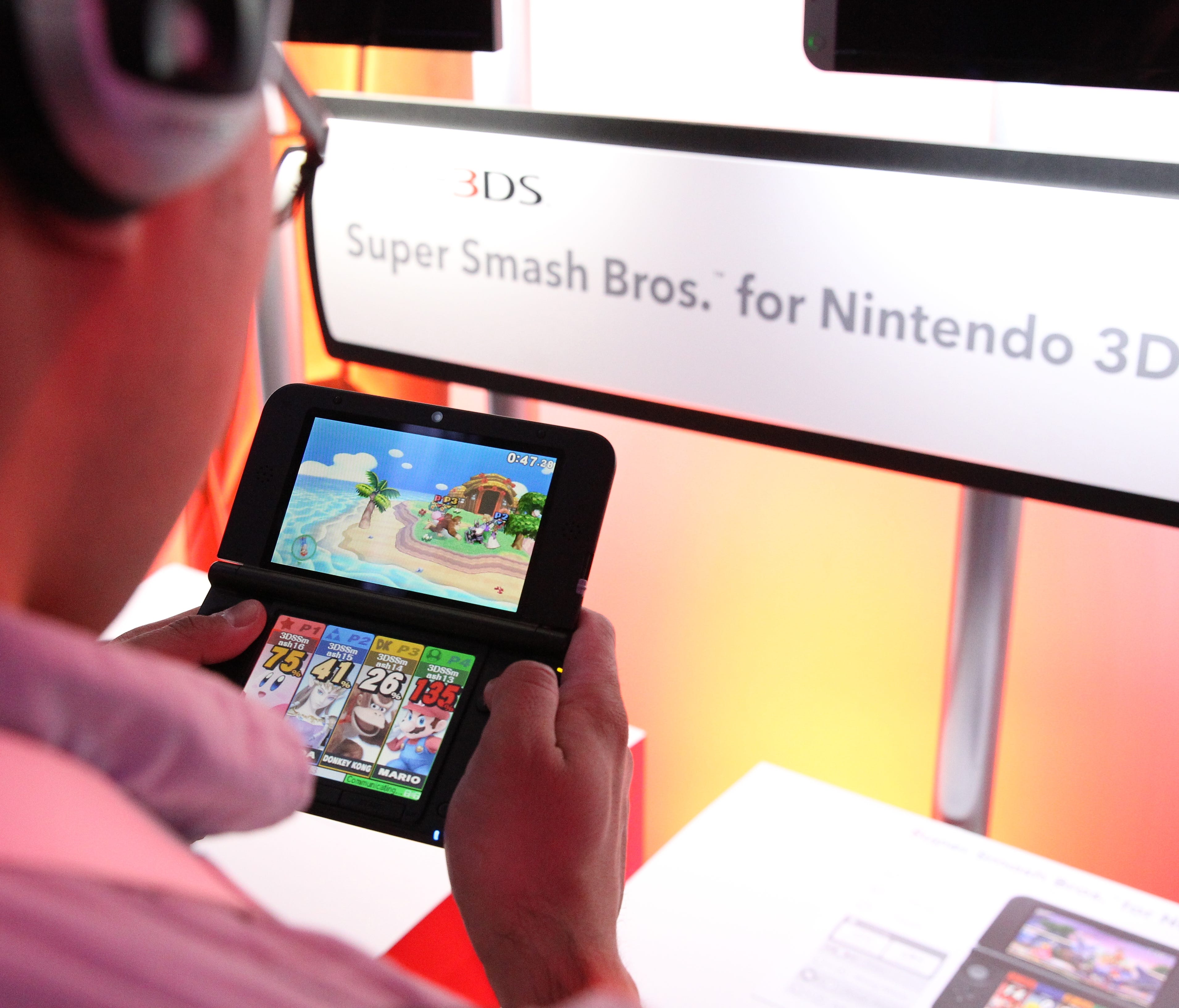 Attendees playing Super Bash Bros on the Nintendo 3DS during the Electronic Entertainment Expo in Los Angeles in 2014.