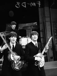 From left, Paul McCartney, Ringo Starr and John Lennon